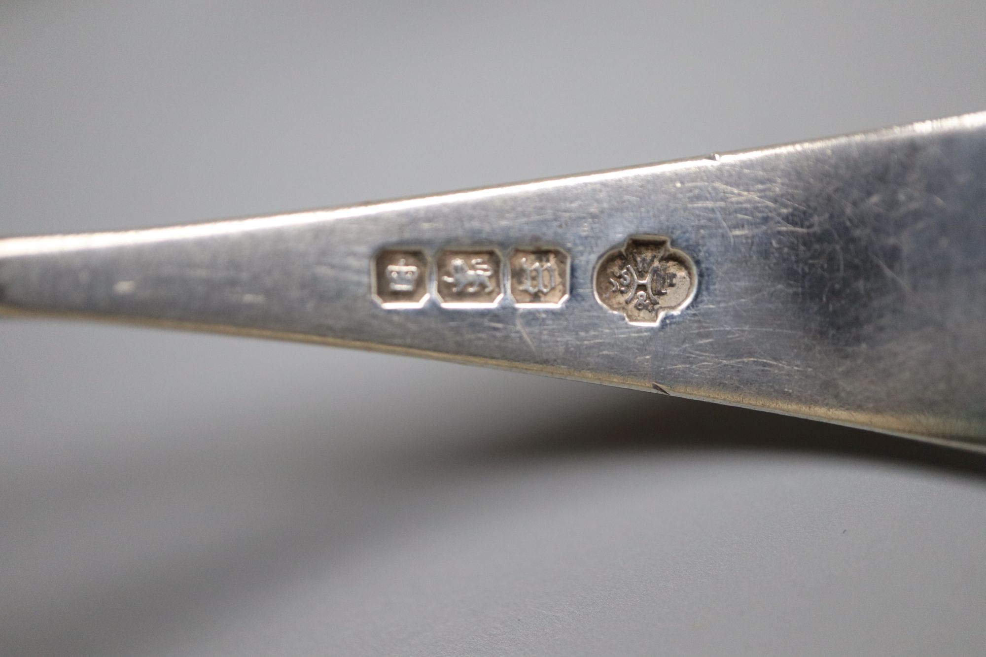An ornate Edwardian silver gilt spoon, 22cm, ten other assorted silver spoons including continental and silver and two small